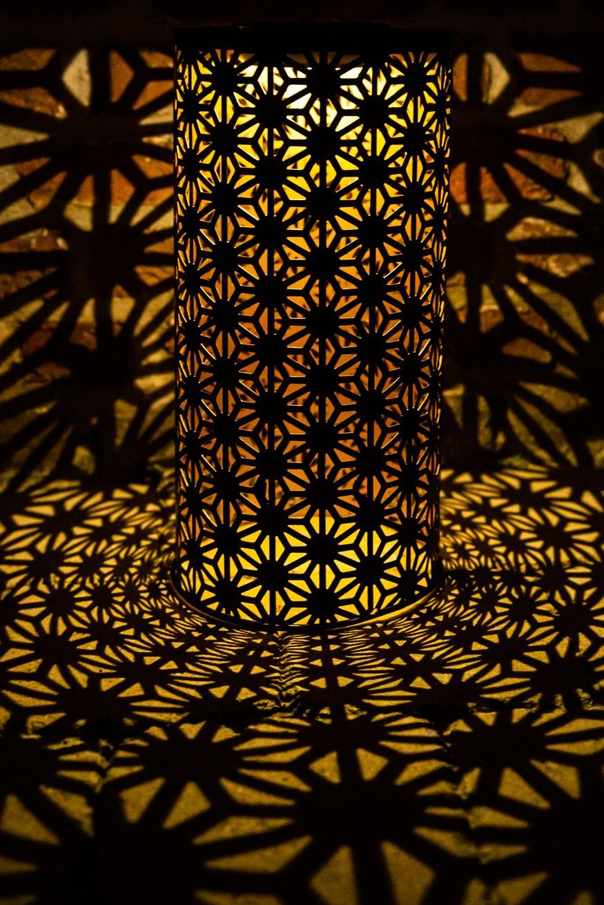 Solar-powered lantern in black metal with gold interior and geometric shapes Garden ID